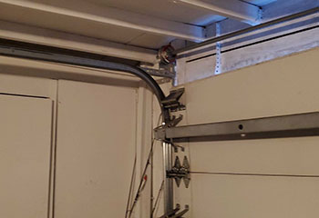 Broken garage door torsion spring causing malfunction on La Palma, CA home garage