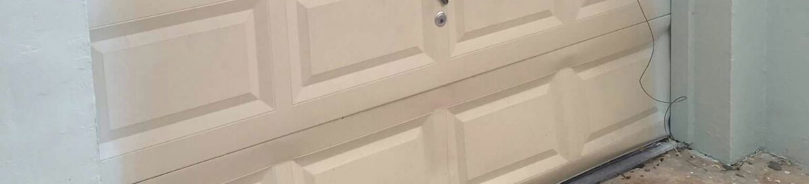 Brand new garage door with smooth painted finish after installation in Cypress, California