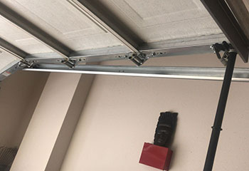 Old garage door awaiting replacement for Garden Grove, CA residence